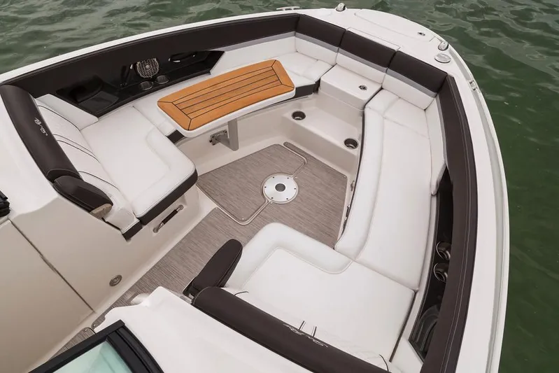  Yacht Photos Pics Manufacturer Provided Image: 2017 Sea Ray SLX 350 boat interior with white seating and wooden table.