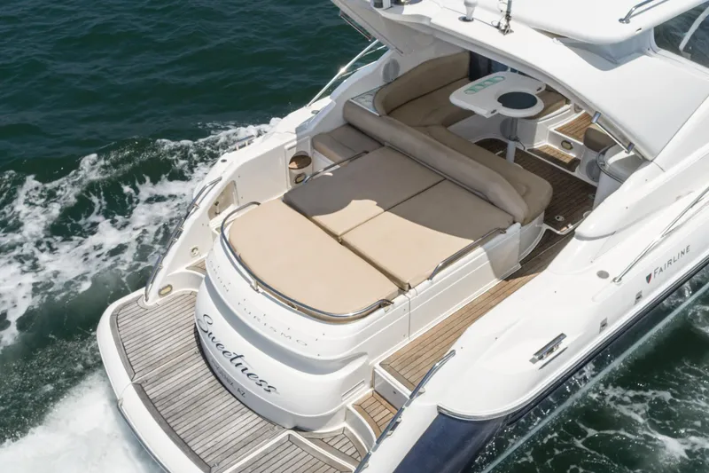  Yacht Photos Pics Fairline 48 Targa 2000 yacht with spacious deck and seating, cruising on open water.