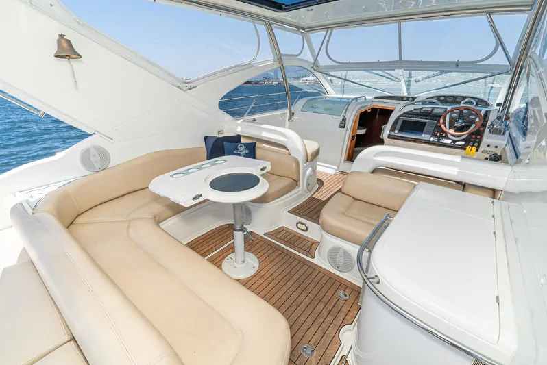  Yacht Photos Pics Luxury interior of 2000 Fairline 48 Targa yacht with beige seating and wooden flooring.
