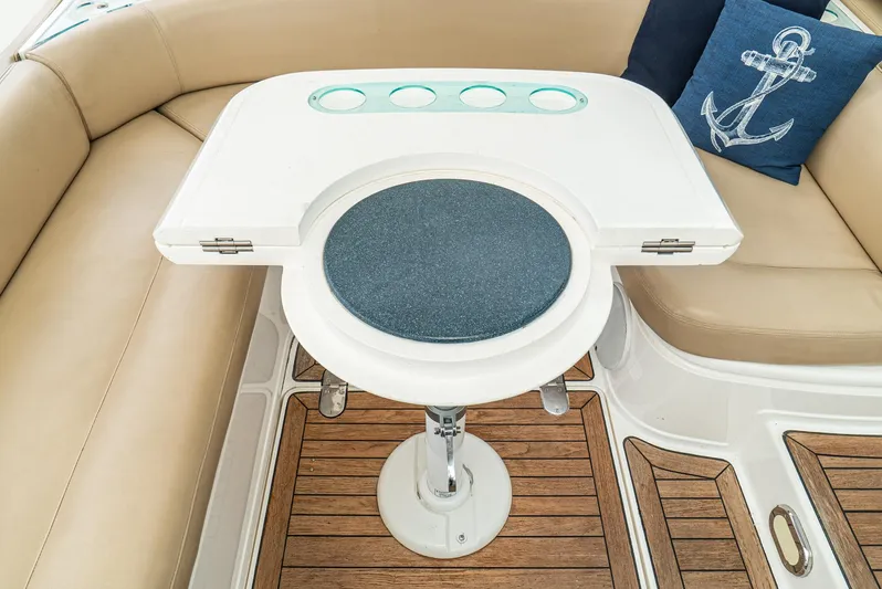  Yacht Photos Pics Luxury seating area on 2000 Fairline 48 Targa yacht with wooden flooring and nautical decor.