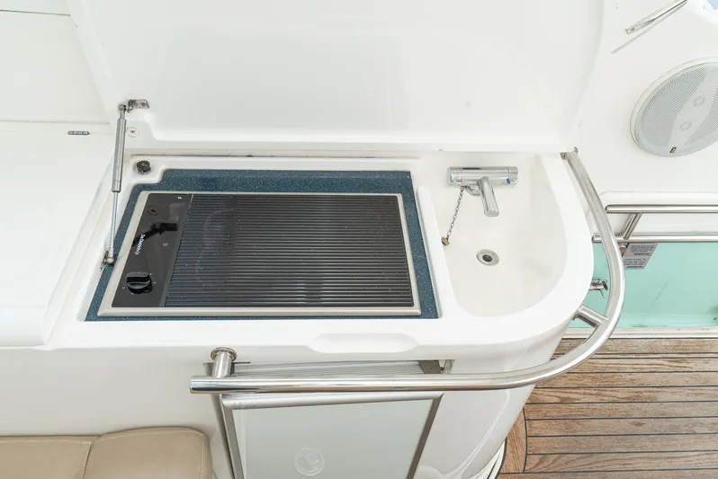  Yacht Photos Pics Outdoor kitchenette on 2000 Fairline 48 Targa yacht with grill and sink.