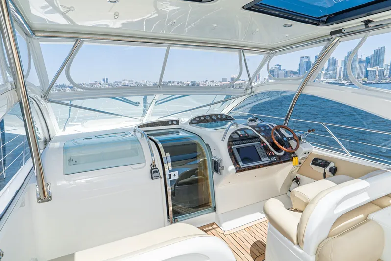  Yacht Photos Pics Helm of 2000 Fairline 48 Targa yacht with city skyline view.