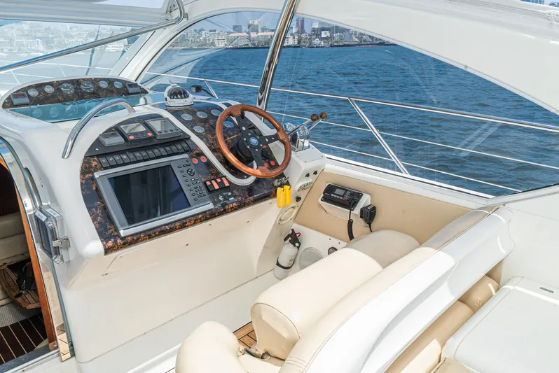  Yacht Photos Pics Helm of 2000 Fairline 48 Targa yacht with ocean view and modern controls.