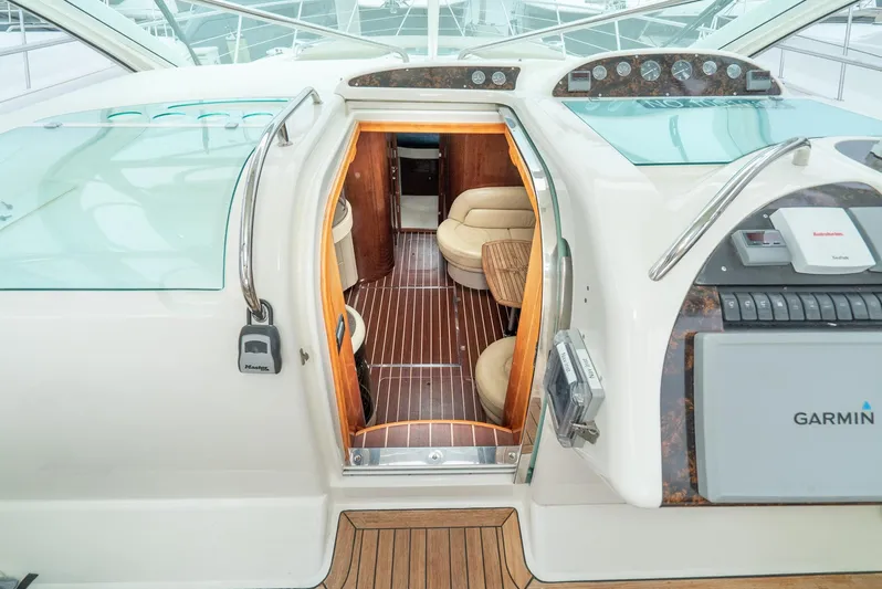  Yacht Photos Pics 2000 Fairline 48 Targa yacht interior with wood flooring and seating area.