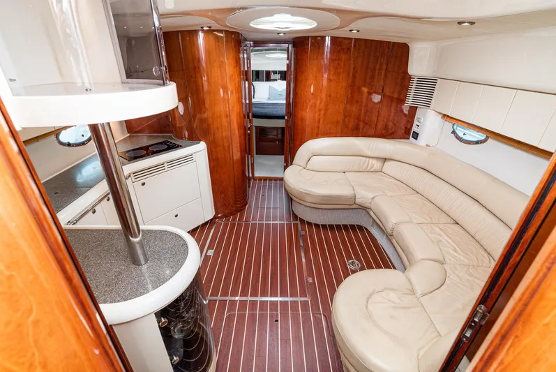  Yacht Photos Pics Luxurious interior of 2000 Fairline 48 Targa yacht with leather seating and wood finishes.