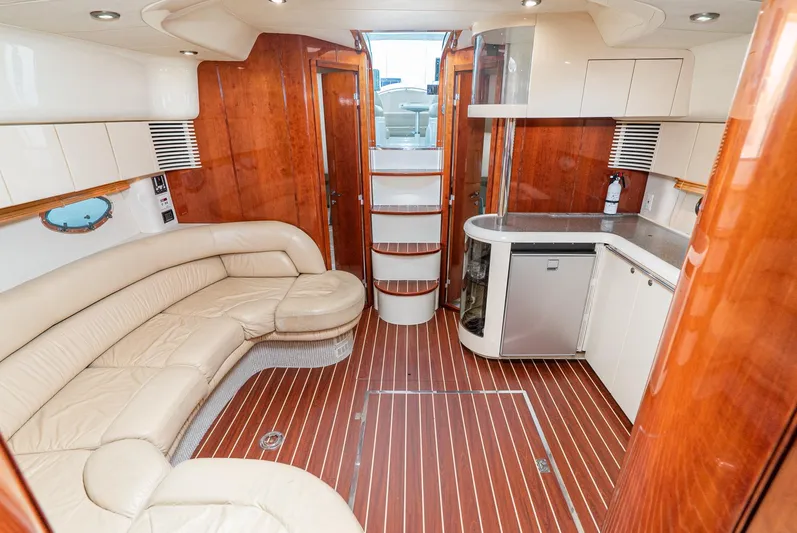  Yacht Photos Pics Luxurious interior of 2000 Fairline 48 Targa yacht with leather seating and modern kitchenette.