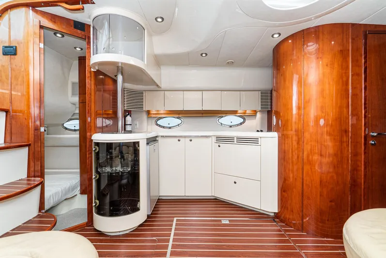  Yacht Photos Pics Luxurious interior of 2000 Fairline 48 Targa yacht with elegant wood finishes and modern amenities.