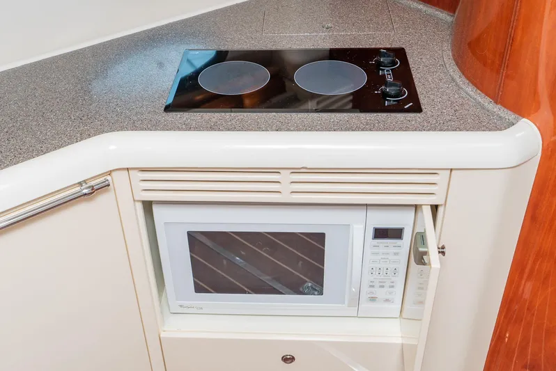  Yacht Photos Pics Kitchen area of 2000 Fairline 48 Targa yacht with stove and microwave.