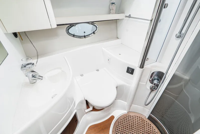  Yacht Photos Pics Luxurious bathroom in 2000 Fairline 48 Targa yacht with modern fixtures and porthole window.