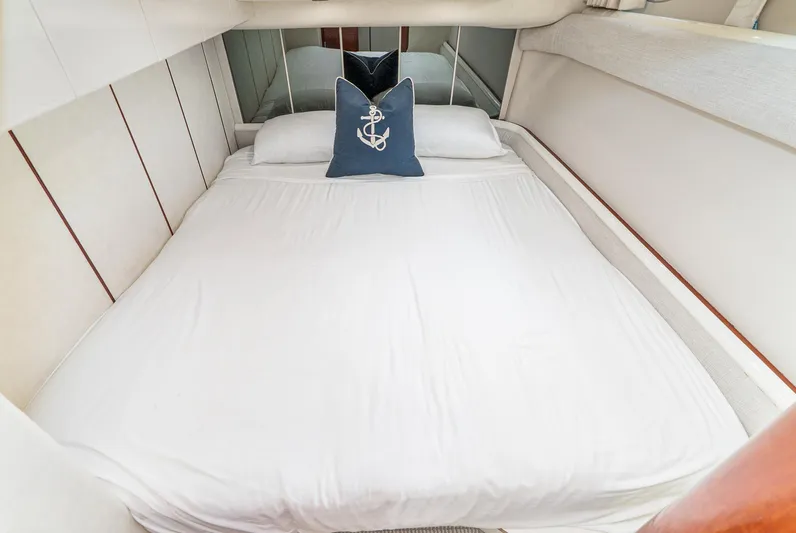  Yacht Photos Pics Cozy bedroom in 2000 Fairline 48 Targa yacht with nautical-themed decor.