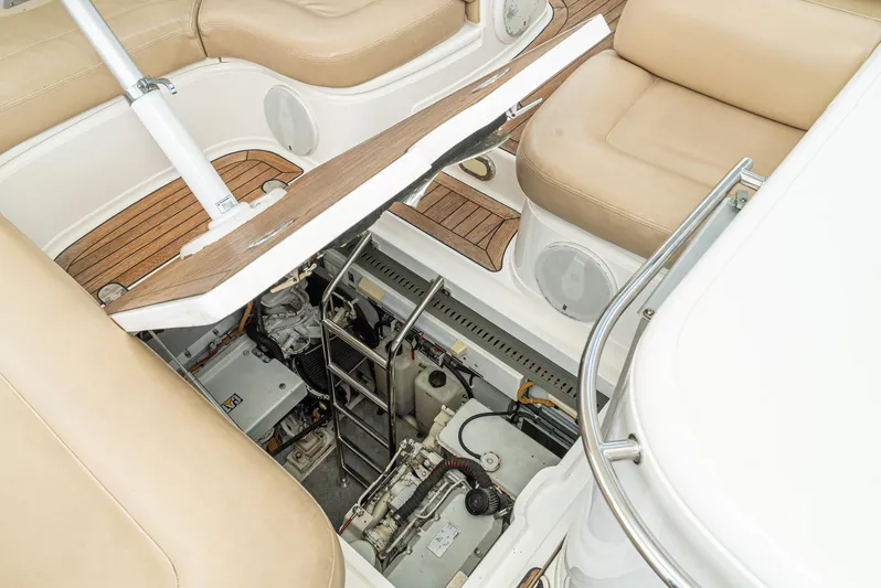  Yacht Photos Pics Engine compartment of 2000 Fairline 48 Targa yacht with beige seating and ladder access.