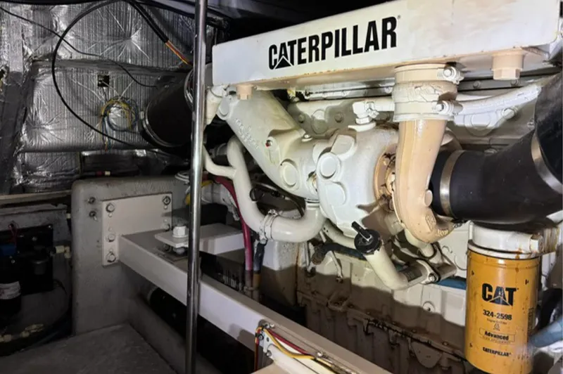Just Blessed Yacht Photos Pics Engine room of 2002 Silverton 43 Motor Yacht with Caterpillar engine components.