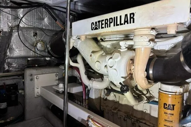 Just Blessed Yacht Photos Pics Engine room of 2002 Silverton 43 Motor Yacht with Caterpillar engine components.