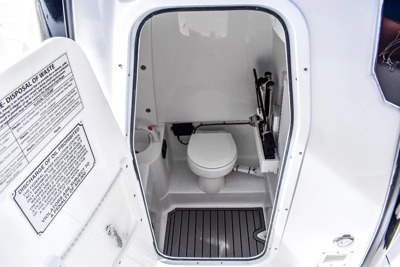  Yacht Photos Pics 2026 Sea Hunt Ultra 285 Coffin Box boat interior with compact marine toilet.