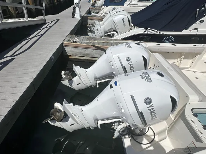  Yacht Photos Pics 2011 Pursuit OS 315 Offshore with Yamaha outboard engines docked at marina.