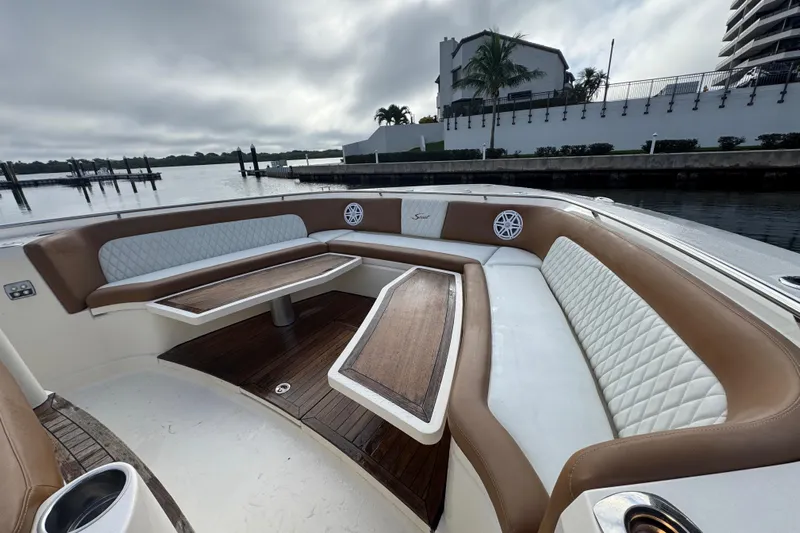  Yacht Photos Pics Luxurious seating area on a 2020 Scout 530 LXF boat with elegant wood tables.