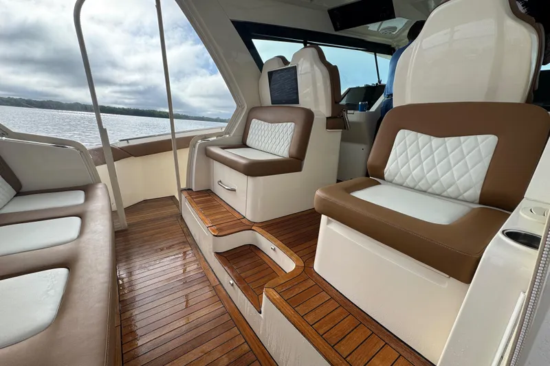  Yacht Photos Pics Luxurious interior of 2020 Scout 530 LXF boat with elegant seating and wooden flooring.