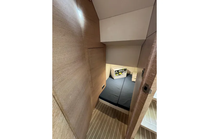  Yacht Photos Pics 2020 Scout 530 LXF cabin interior with wooden finish and cozy bedding.
