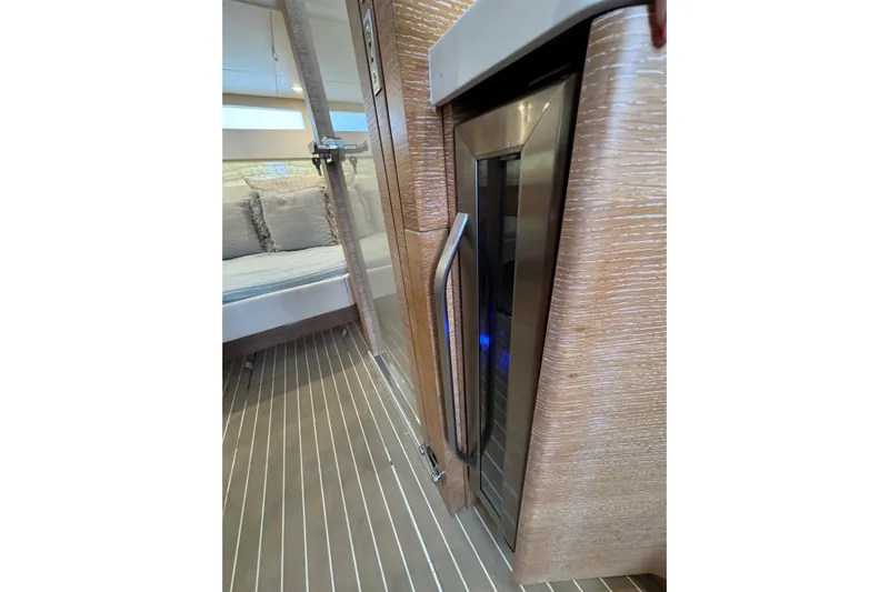  Yacht Photos Pics Luxurious interior of 2020 Scout 530 LXF yacht with modern wood finish and cozy seating.