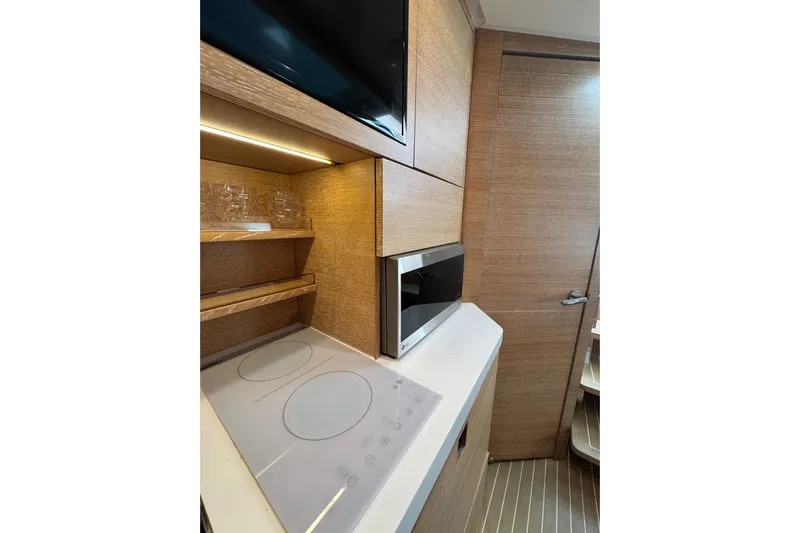  Yacht Photos Pics Modern kitchen area in 2020 Scout 530 LXF yacht with stove and microwave.