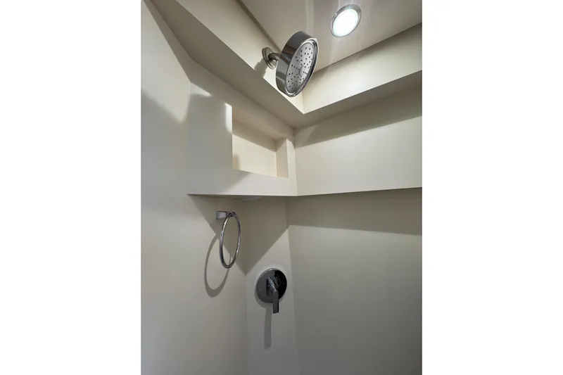 Yacht Photos Pics Shower area in 2020 Scout 530 LXF boat, featuring modern fixtures and lighting.