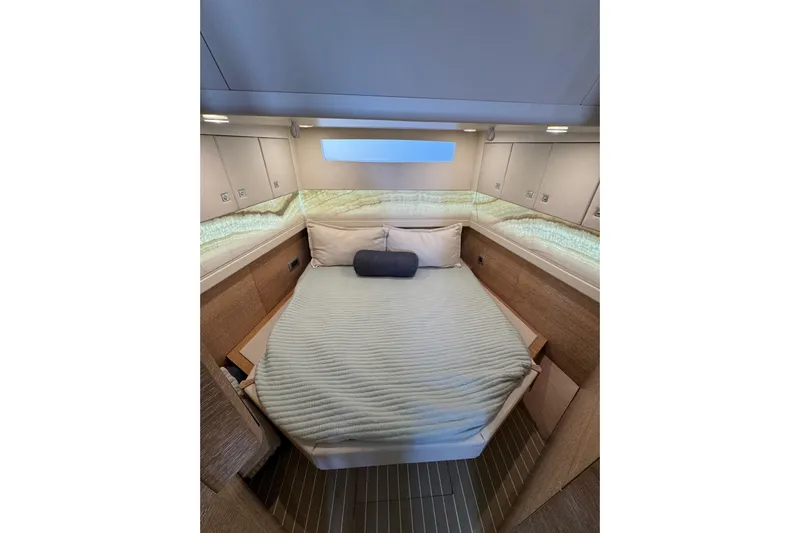  Yacht Photos Pics Luxurious cabin interior of 2020 Scout 530 LXF yacht with cozy bedding.