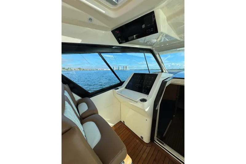  Yacht Photos Pics 2020 Scout 530 LXF boat interior with modern dashboard and ocean view.