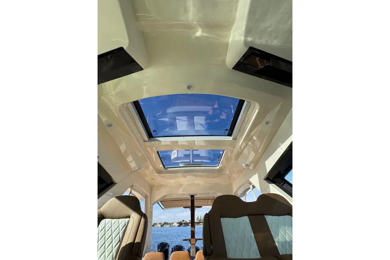  Yacht Photos Pics Interior view of 2020 Scout 530 LXF boat with sunroof and luxurious seating.