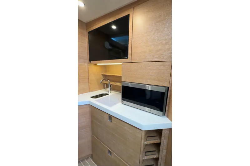  Yacht Photos Pics 2020 Scout 530 LXF yacht interior with modern kitchenette, sink, and microwave.
