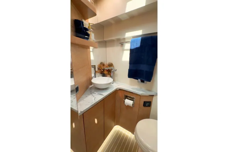  Yacht Photos Pics Luxurious bathroom interior of 2020 Scout 530 LXF yacht with modern fixtures and elegant design.