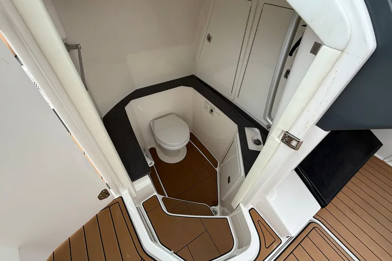  Yacht Photos Pics 2022 Aviara AV32 OB boat bathroom with modern design and wood flooring.