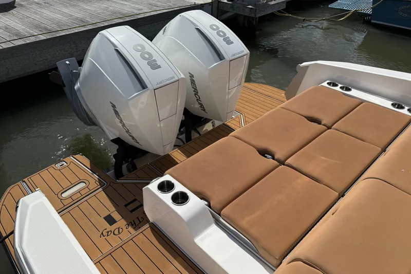  Yacht Photos Pics 2022 Aviara AV32 OB boat with twin Mercury outboard engines and cushioned deck seating.