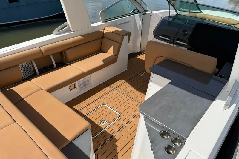  Yacht Photos Pics 2022 Aviara AV32 OB boat interior with tan seating and sleek design.
