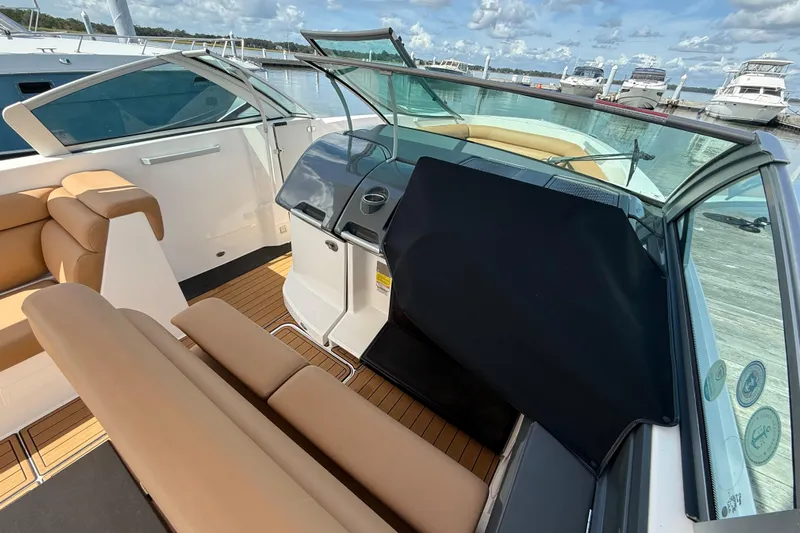  Yacht Photos Pics 2022 Aviara AV32 OB boat interior with tan seating and sleek dashboard design.