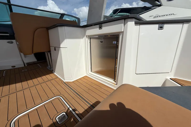 Yacht Photos Pics 2022 Aviara AV32 OB boat interior with teak flooring and sleek cabinetry.