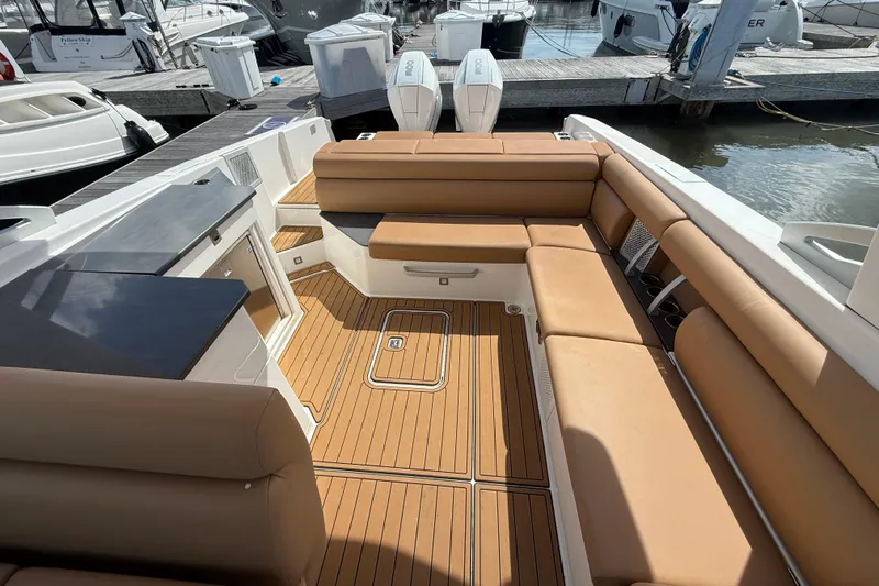  Yacht Photos Pics Luxurious 2022 Aviara AV32 OB boat interior with tan seating and sleek design.