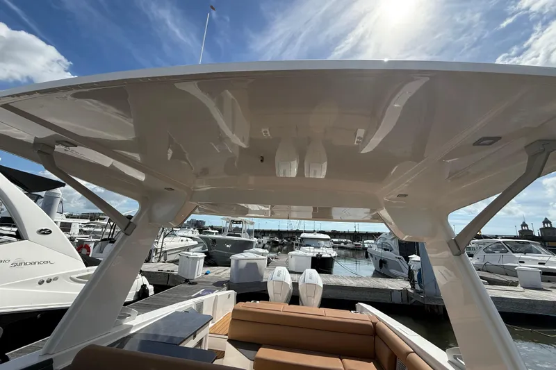  Yacht Photos Pics 2022 Aviara AV32 OB boat at marina, showcasing sleek design and spacious seating.