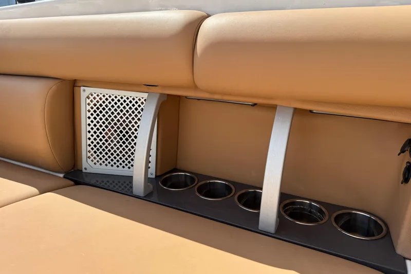  Yacht Photos Pics 2022 Aviara AV32 OB boat interior with tan seating and built-in cup holders.