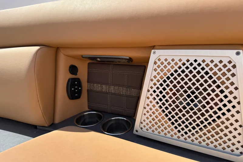  Yacht Photos Pics Interior of 2022 Aviara AV32 OB boat with speaker, controls, and cup holders.