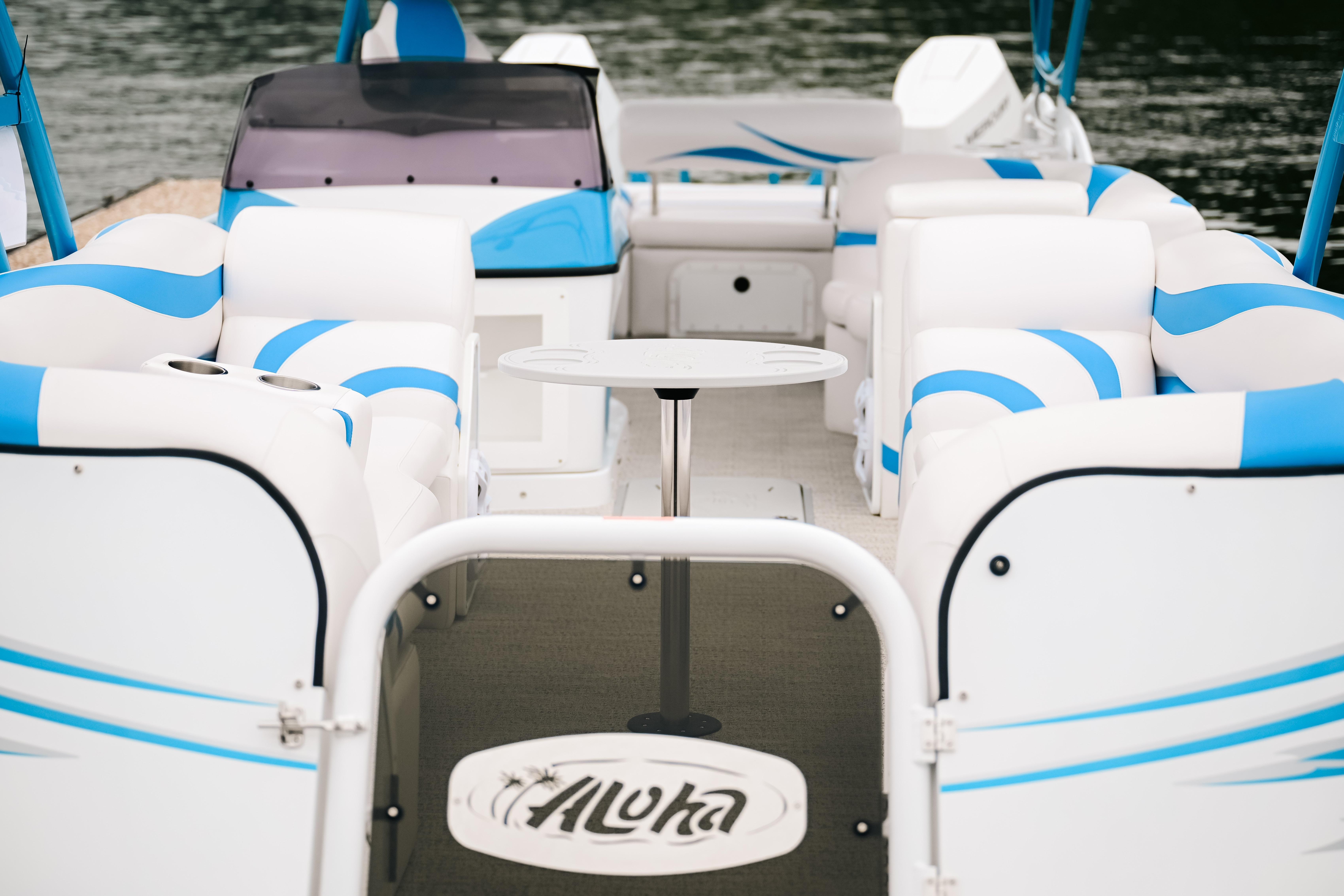 2026 Aloha Pontoon Paradise Twin X32 with spacious seating and modern design on the water.