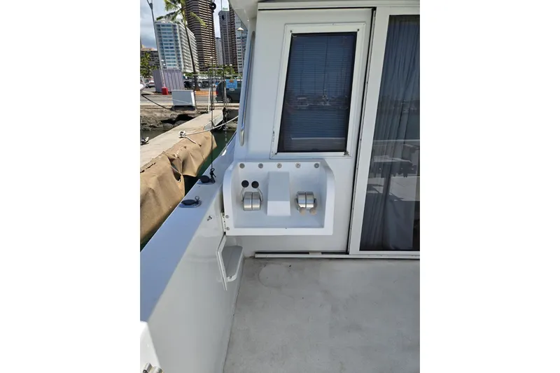  Yacht Photos Pics 1994 Navigator 5600 yacht deck with control panel and marina view.