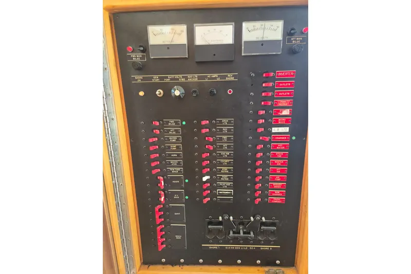  Yacht Photos Pics Control panel of a 1994 Navigator 5600 boat with switches and gauges.