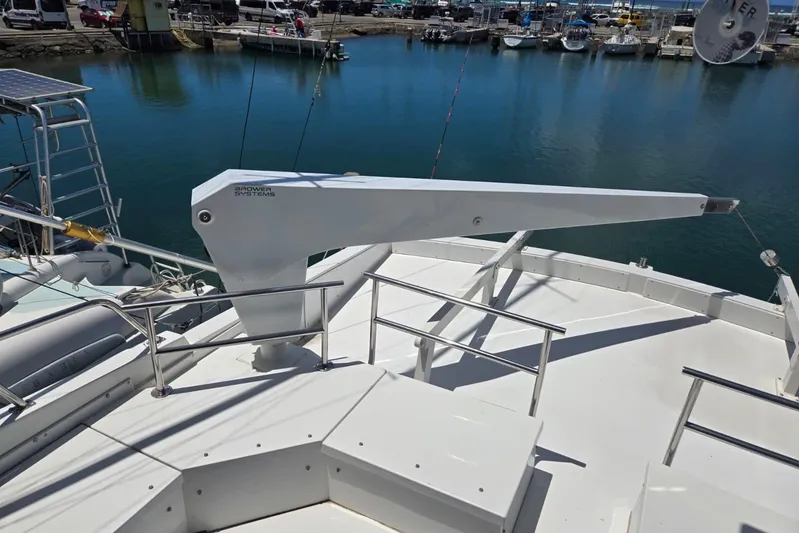  Yacht Photos Pics Deck of 1994 Navigator 5600 yacht with Brower Systems crane, docked at marina.