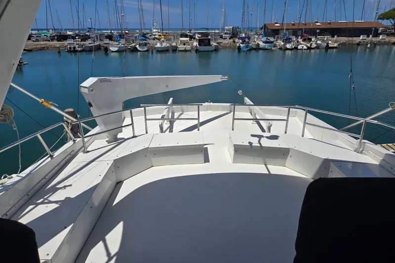  Yacht Photos Pics 1994 Navigator 5600 yacht deck overlooking marina with sailboats and clear blue water.