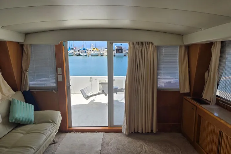  Yacht Photos Pics Interior view of a 1994 Navigator 5600 yacht with marina in the background.