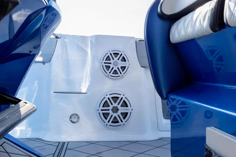  Yacht Photos Pics 2020 Nor-Tech 390 Sport Center Console interior with blue seating and audio speakers.