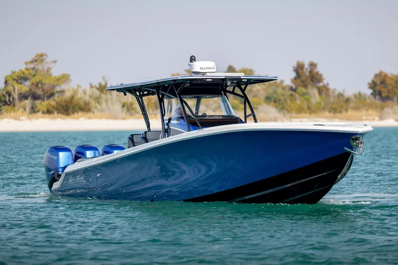  Yacht Photos Pics 2020 Nor-Tech 390 Sport Center Console boat on water, featuring sleek blue design.