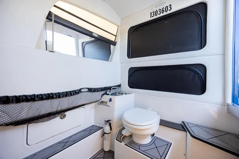  Yacht Photos Pics 2020 Nor-Tech 390 Sport Center Console interior with toilet and sink.