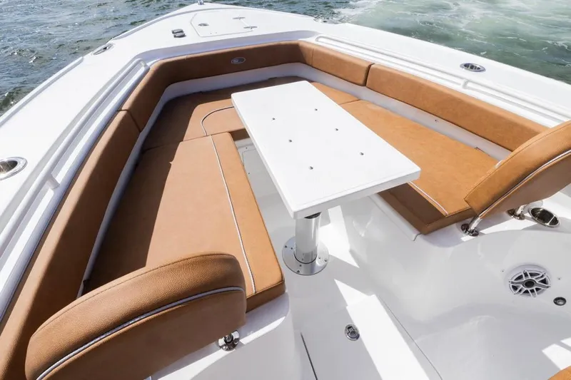  Yacht Photos Pics 2026 Sea Hunt Ultra 275 SE boat interior with tan seating and white table.