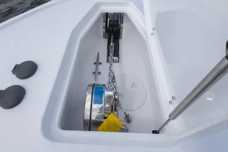  Yacht Photos Pics Anchor compartment of 2026 Sea Hunt Ultra 275 SE boat, featuring chain and winch.